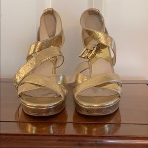 Women’s gold Michael by Michael Kors 4” heels.